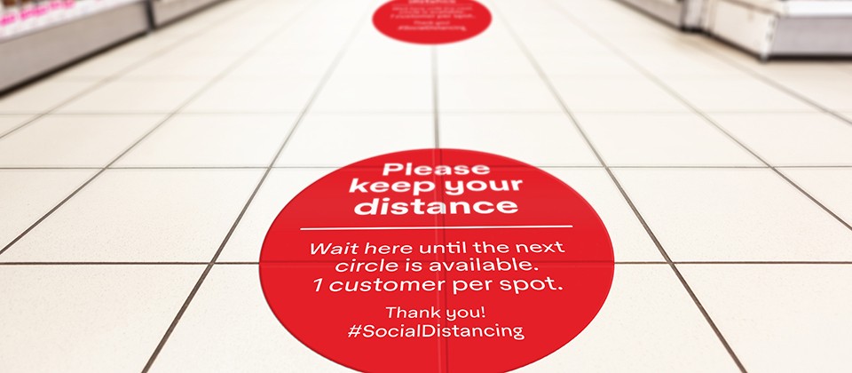Social Distancing floor signage at a supermarket